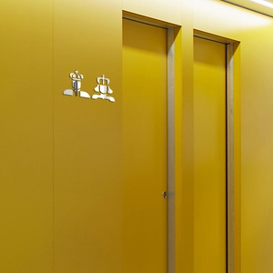 Detail view of 3D mirror acrylic bathroom sign featuring silver King and Queen silhouettes