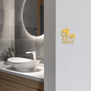 Golden acrylic 3D mirror toilet wall sticker with cartoon figure on grey tile wall