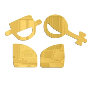 Macro detail of 4pcs golden acrylic mirror wall stickers with abstract bathroom signs