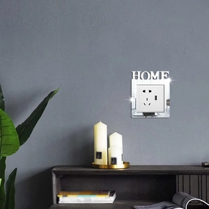Detail showing acrylic mirror switch cover with HOME cutout on a gray interior wall