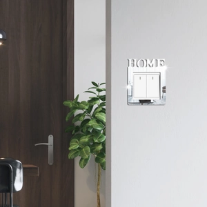 Macro view of silver mirror HOME wall light switch frame with reflective finish