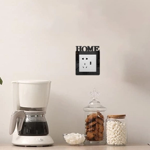 Kitchen setting with black decorative HOME wall socket cover plate for standard outlets