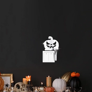 Halloween pumpkin wall sticker with silver mirror finish around light switch frame