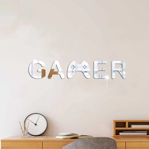 Silver mirror acrylic GAMER wall sticker with game controller icon on a white wall