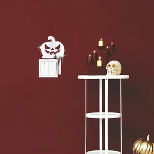 Mirror acrylic pumpkin head wall sticker decorating a light switch for Halloween