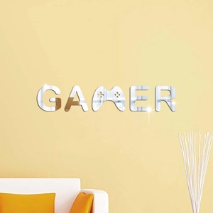 Macro view of silver mirror acrylic GAMER wall sticker with gamepad design letter M