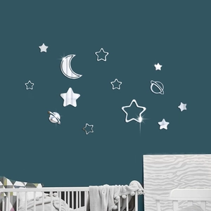 Detailed mirror acrylic star and moon wall stickers on a dark wall in a nursery