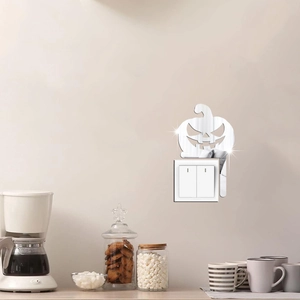 Silver mirror acrylic pumpkin wall decal surrounding a light switch in a cozy home setting