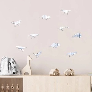 Stickers muraux dinosaures miroir montrant des détails de reflet sur mur rose clair