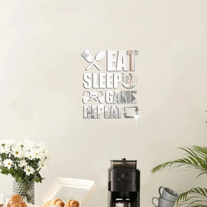 Dettaglio macro di adesivi murali a specchio 3D Eat Sleep Game Repeat in acrilico argento