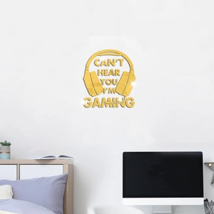 Détail du sticker mural casque en acrylique doré avec texte Gaming pour déco de chambre