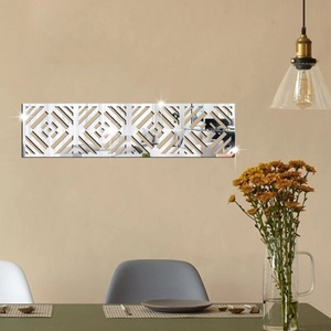 Detail of silver acrylic mirror wall stickers with geometric hollow pattern on dining wall