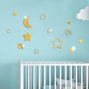 Detailed view of golden mirror stars and moon acrylic wall stickers in a baby room nursery