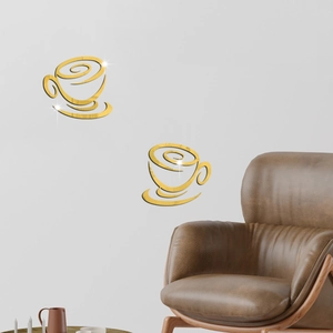 Close-up of golden acrylic 3D coffee cup wall stickers with high-gloss mirror effect