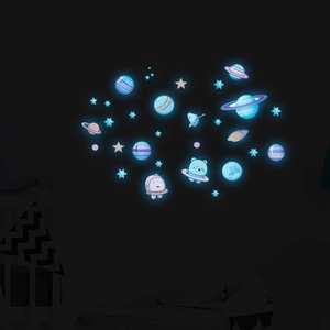 Luminous solar system wall stickers with astronaut and stars glowing in the dark blue light