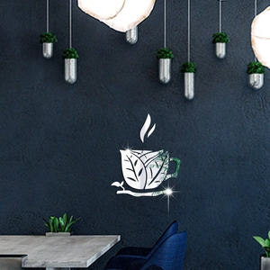 Detail view of mirror acrylic coffee cup wall sticker with hollow leaf patterns on blue wall