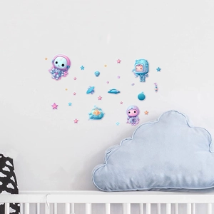 Detailed view of luminous cartoon astronaut and planet wall stickers in a nursery setting