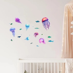 Detailed view of colorful jellyfish and fish wall stickers in a cozy nursery room setting