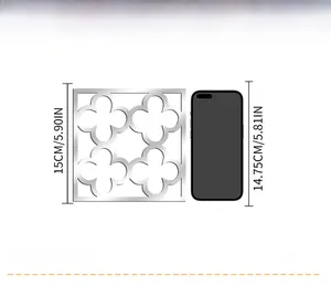 Size comparison of 15cm silver acrylic mirror wall sticker next to a mobile phone