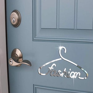 Detail of mirrored silver Fashion acrylic wall sticker with pattern on a blue door