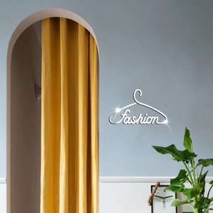 Silver mirror acrylic wall sticker featuring a fashion hanger design on a modern blue wall