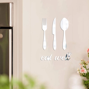 Detail of silver mirror acrylic kitchen wall sticker featuring eat well text and cutlery set