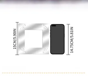 Size comparison of a 15cm square silver acrylic mirror wall sticker next to a smartphone
