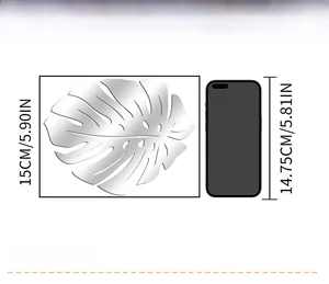 Detailed size chart of leaf mirror wall sticker showing 15cm height against a phone