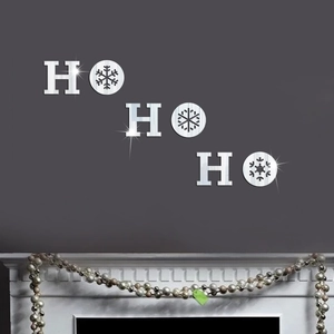 Detail of 3D mirror HO HO HO snowflake wall stickers on a modern grey living room wall