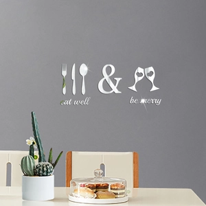 Detail of silver mirror acrylic wall stickers with kitchen utensils and eat well phrases