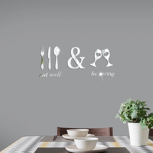 Close-up of silver mirror acrylic wall stickers with cutlery design and Eat Well text