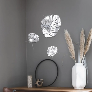 Macro detail of Monstera leaf acrylic mirror wall stickers with silver reflective finish