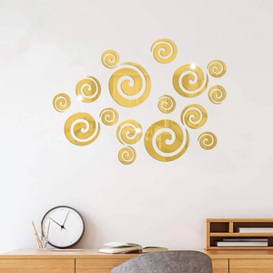 Détails de stickers muraux miroirs spirales dorés dans un décor de bureau à domicile