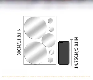 Size comparison of 3D acrylic mirror circle wall decals next to a smartphone device