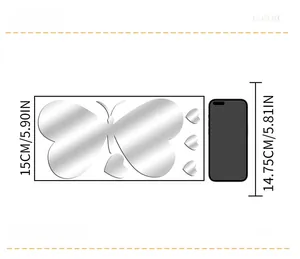Size comparison of silver butterfly and heart acrylic mirror wall decals next to a phone