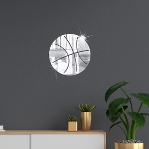Detail of a basketball acrylic mirror wall sticker on a dark modern living room wall