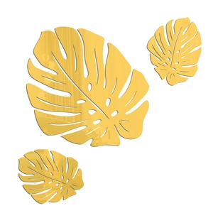 Detailed view of gold monstera leaf mirror wall stickers in three different sizes