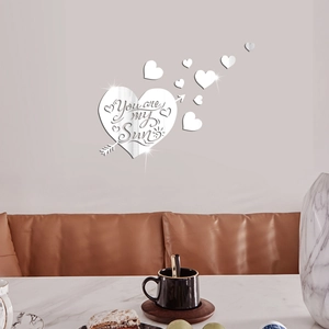 Detail of silver mirror acrylic wall sticker featuring Heart and You are my Sun engraving
