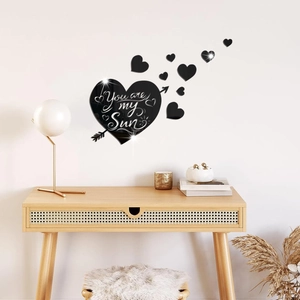Detail of mirrored acrylic heart wall sticker with You are my Sun text and arrow design