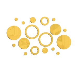 Macro detail of golden acrylic mirror wall stickers with circular and ring shapes