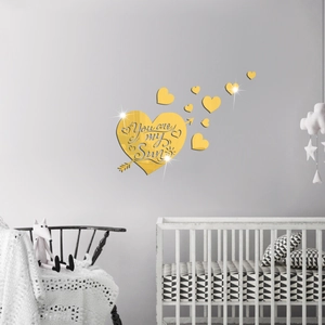 Detail of gold mirror acrylic heart wall sticker with You are my Sun text engraving