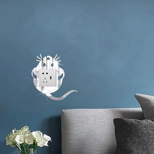 Detail of silver mouse acrylic mirror wall sticker on blue wall beside a light switch