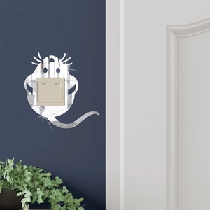Detailed view of silver mouse mirror wall sticker surrounding a light switch panel