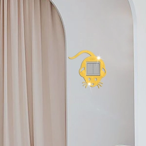 Detailed view of golden mirror acrylic mouse wall sticker around a double light switch