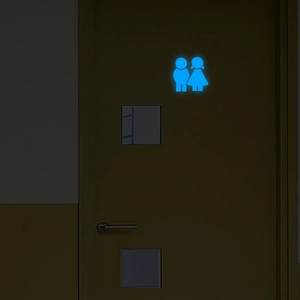 Luminous toilet door sticker featuring glowing male and female icons on dark background