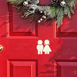 Luminous toilet door stickers with cartoon male and female figures on a red wooden door