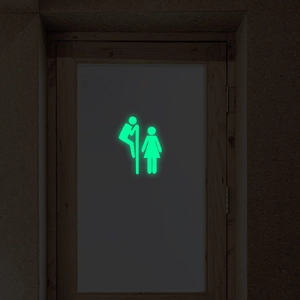 Glow-in-the-dark toilet wall sticker showing luminous funny male and female figures
