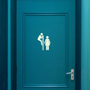 Glow-in-the-dark bathroom door sticker featuring a funny peeking couple design on a door