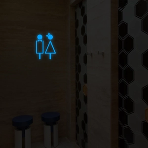 Panneau de salle de bain LED bleu lumineux avec icônes sur décor mural hexagonal sombre