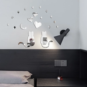 Mirror acrylic wall stickers featuring cats, hearts, and moon in a modern bedroom setting